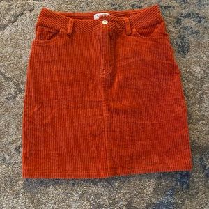 orange corduroy skirt. has pockets. great for fall. great condition. barely used